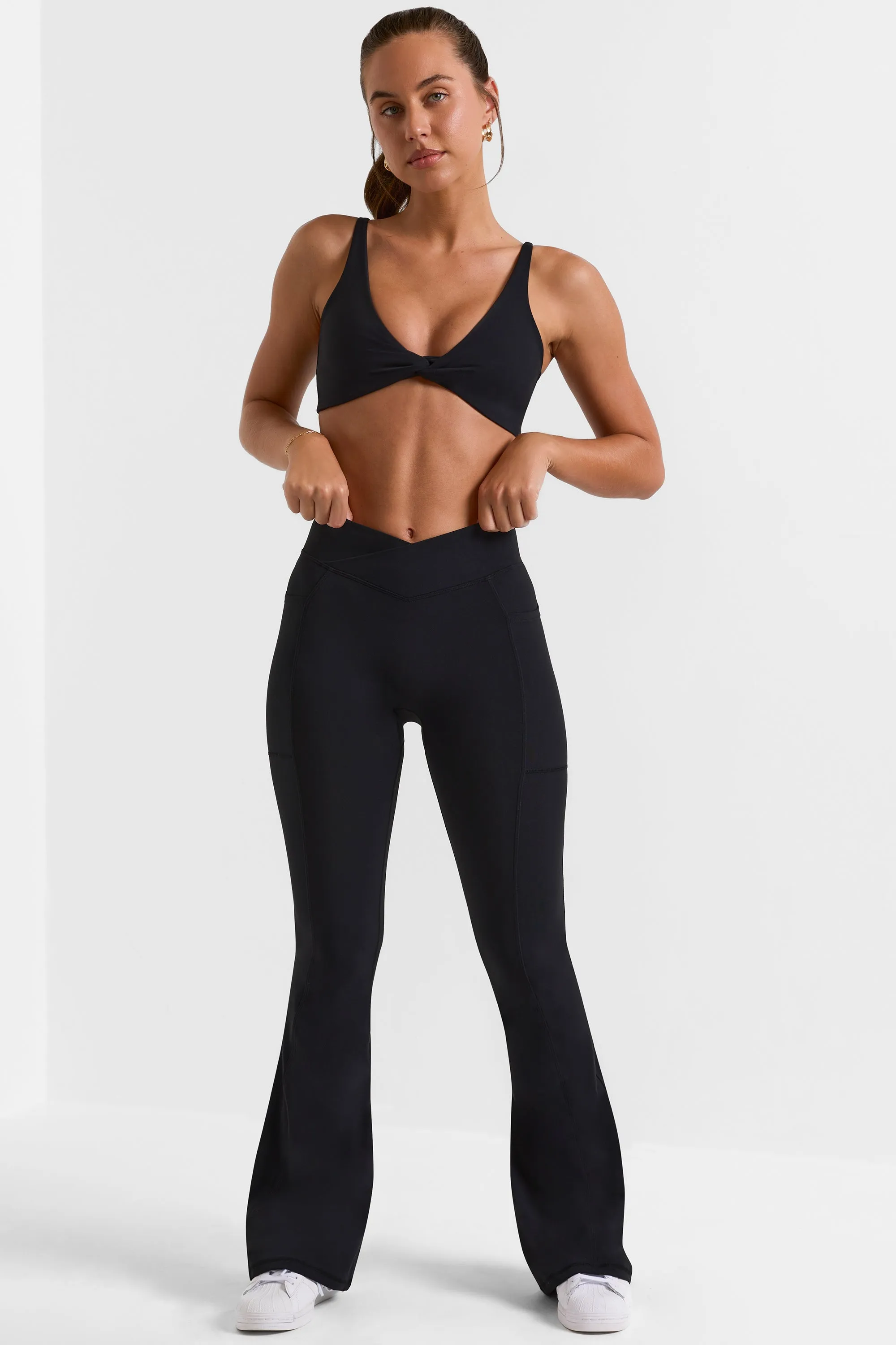 Cross Waistband Flare Pocket Leggings in Black