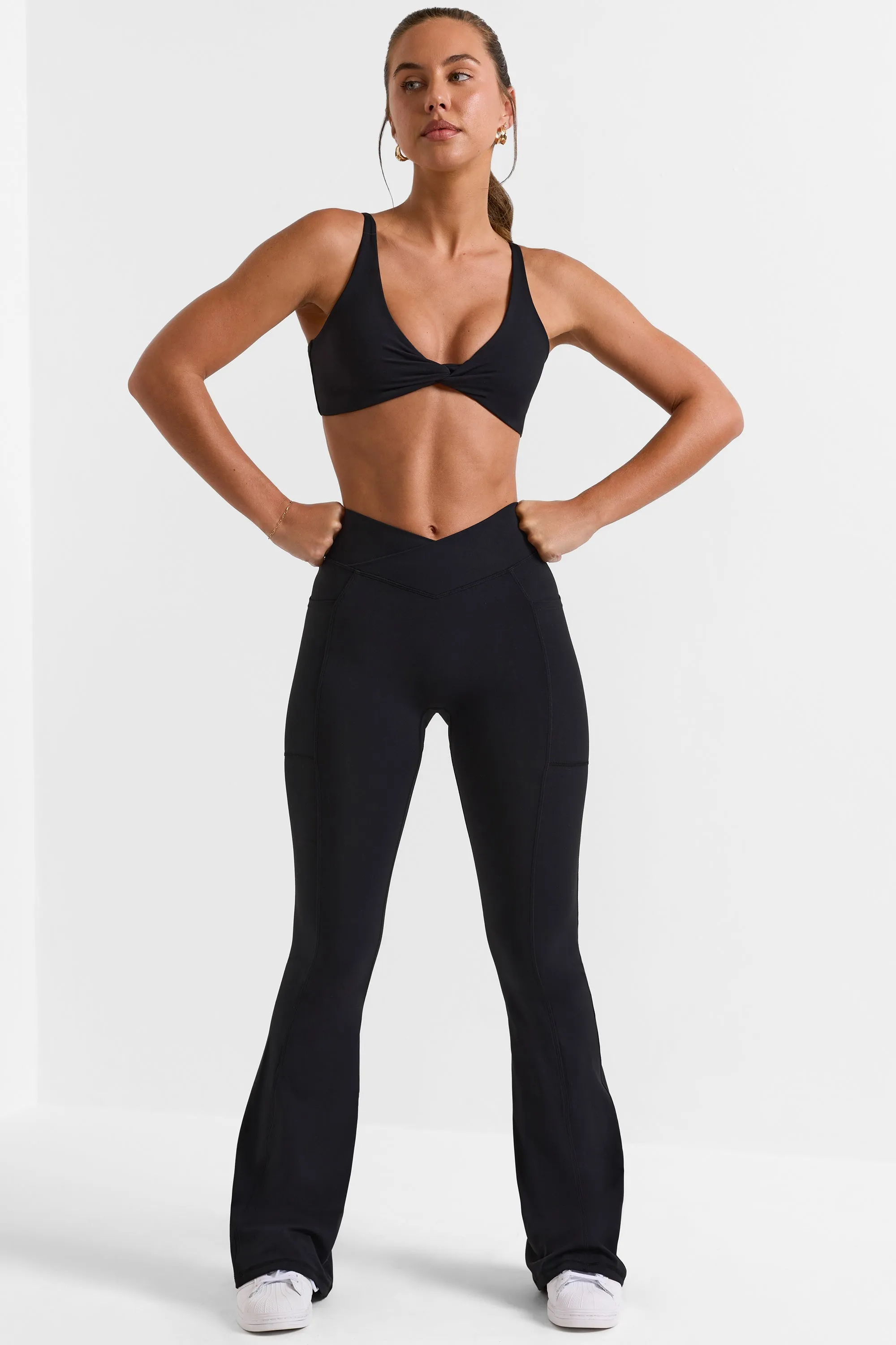 Cross Waistband Flare Pocket Leggings in Black