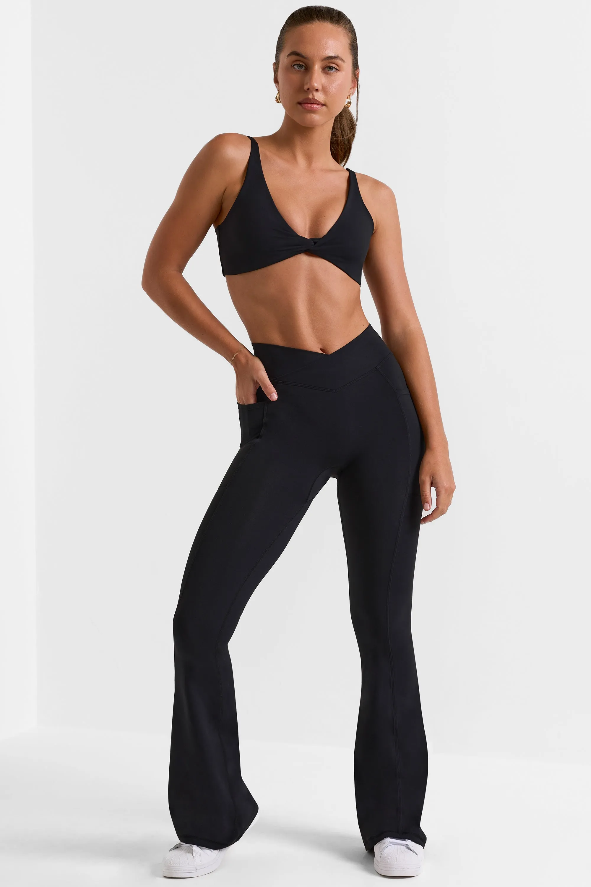 Cross Waistband Flare Pocket Leggings in Black