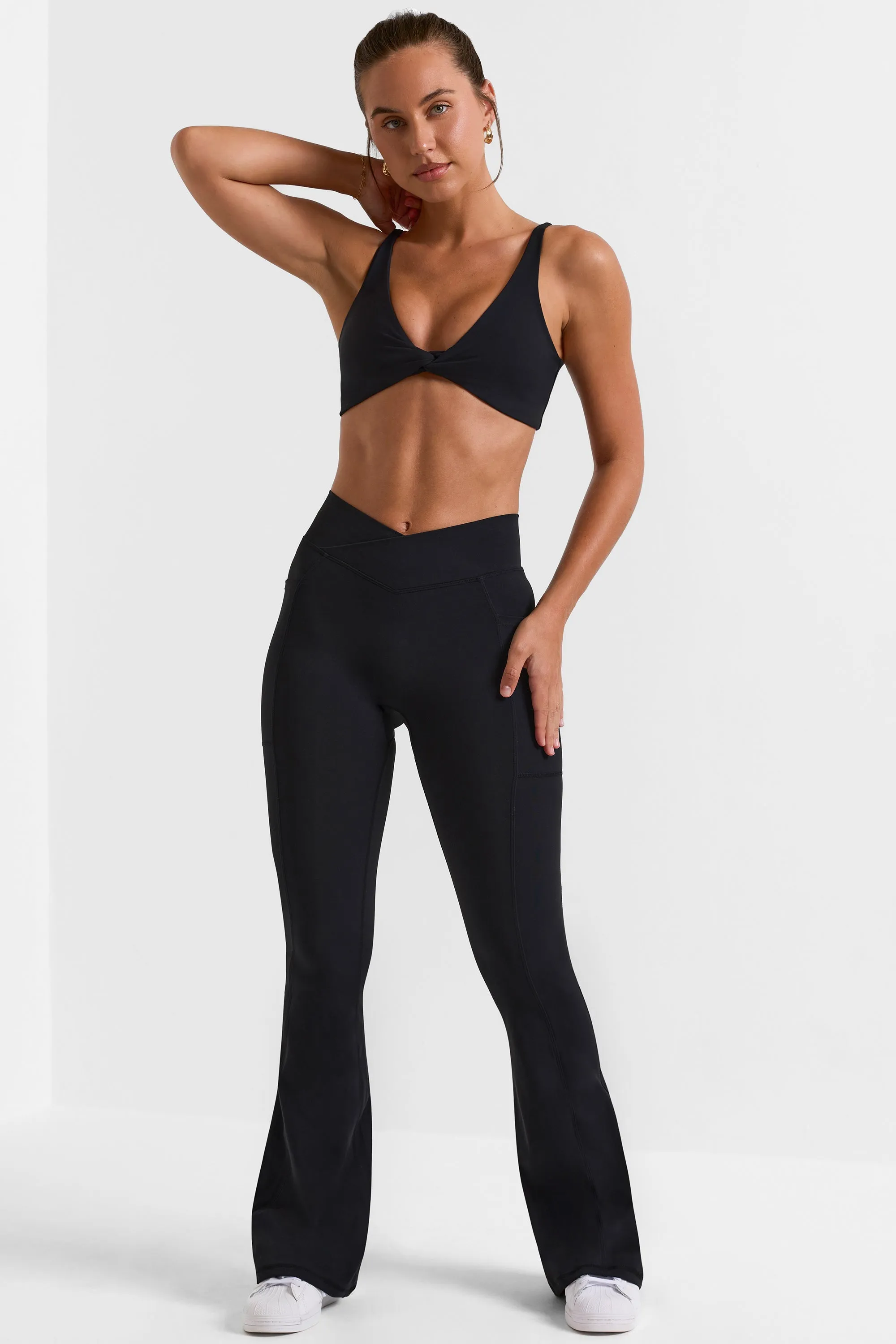 Cross Waistband Flare Pocket Leggings in Black